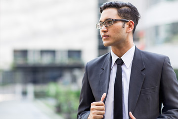 Young asian businessman working outdoors