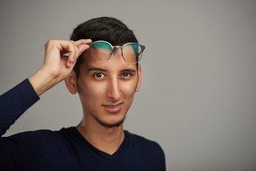 Obraz premium Young man with glasses on forehead