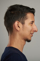 Fototapeta premium Profile portrait of young hispanic man