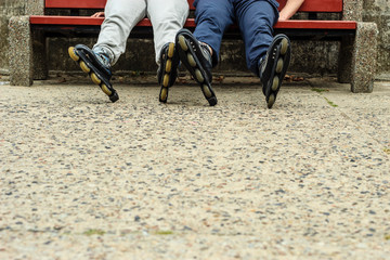 People friends relaxing with roller skates.