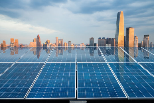 solar energy panel with city twilight