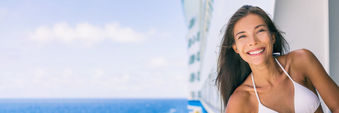 Cruise vacation travel woman relaxing onboard ship enjoying ocean from balcony banner panoramic crop. Asian girl portrait with copy space.