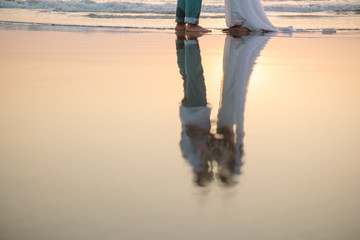 Lovers were married in India. Walk on the beach