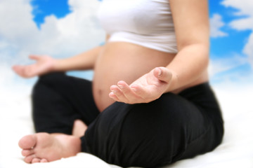Fototapeta na wymiar Pregnant woman meditating.