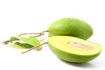 Green mangoes with leaves isolated on a white background