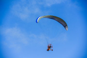 Un-identified man flying with glider