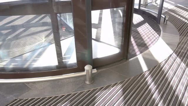 Revolving glazed door. Entrance of mall