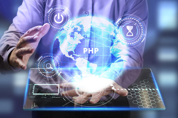 The concept of business, technology, the Internet and the network. A young entrepreneur working on a virtual screen of the future and sees the inscription: PHP