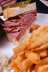 smoked meat sandwich with fries