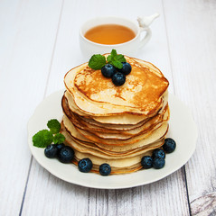 Plate with pancakes and blueberries