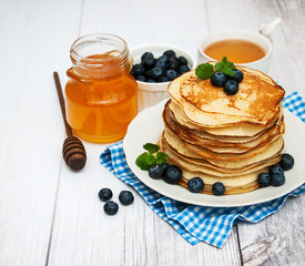 Plate with pancakes and blueberries