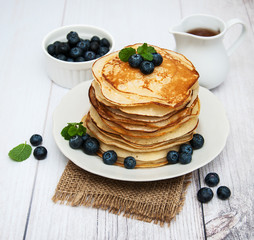 Plate with pancakes and blueberries