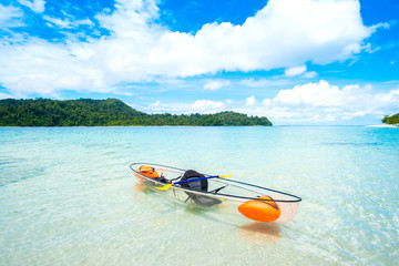 Transparent Canoe Kayak In Tropical Ocean and blue sky,Phuket,Thailand.