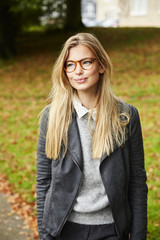 Beautiful blond at leisure in park, smiling