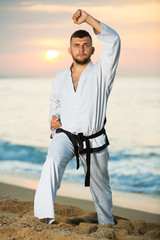 Guy doing karate poses