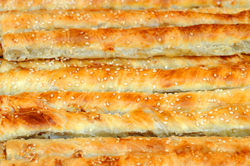 Puff pastry with filling. Rollini with brynza cheese and spinach. Concept of national cuisines of the world.