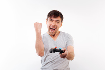 Fototapeta na wymiar Happy man celebrating victory in video game