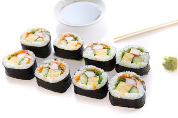 Futomaki sushi , Japanese roll rice egg avocado cucumber and caviar isolated in white background
