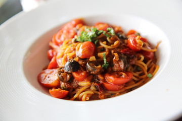 Spaghetti witn tomato and olive , Italian food