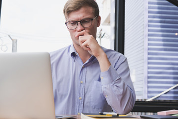 Fototapeta premium businessman use laptop with business plan at workplace. man work with computer at office. finance market analyst analyze financial data.