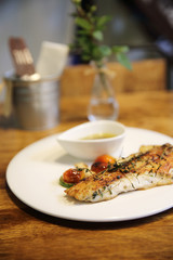 Sea bass fillet on wood background