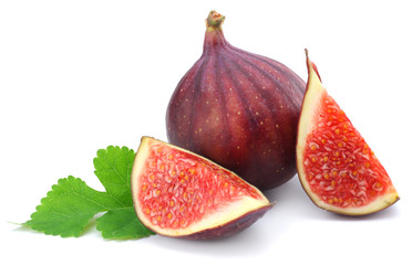 Fig fruit with green leaf isolated on white. Clipping Path