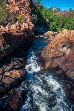 The creek flowing in between rocks at Edith Falls, Katherine, Australia.