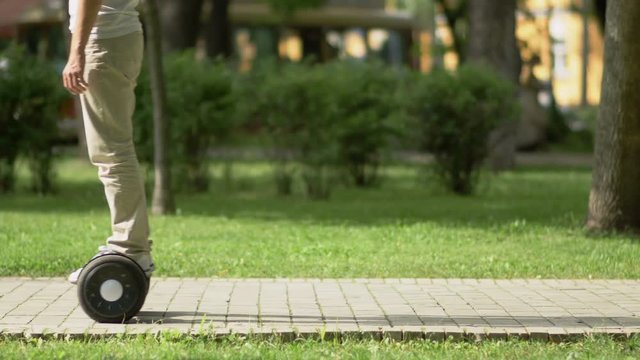 Man on gyroscooter drives on the road