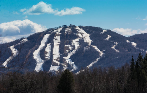 mountain ski slopes on blue sky