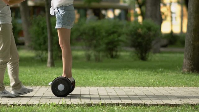 Man learns the woman to drive on gyroscooter