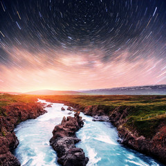Hodafoss very beautiful Icelandic waterfall. It is located in the north near Lake Myvatn and the Ring Road. Fantastic starry sky and the milky way
