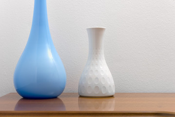 Two Elegant Vases on a Wooden Chest