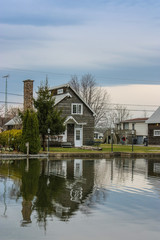 reflection of a house on a river