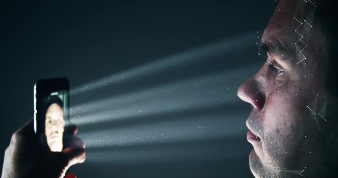 Male using latest smartphone technology for a biometric facial recognition unlock