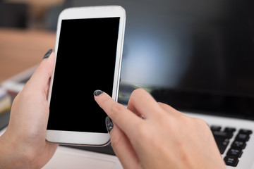 businesswoman use mobile phone at workplace. young woman texting message on smart phone at office. freelancer use cellphone for online network connection