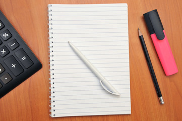 writes in a notebook around