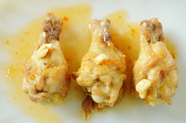 fried chicken drumsticks with salt and pepper dressing sweet chili sauce on plate