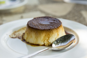 Egg custard and spoon