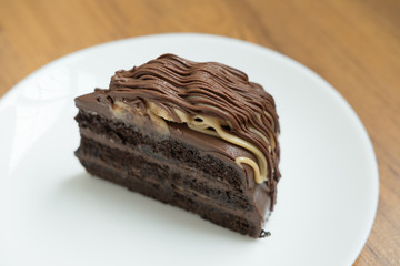 banana caramel chocolate cake. tasty deliciouse dessert on white plate. homemade bakery pastry