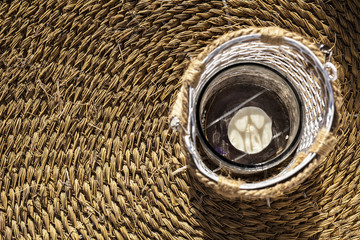 Decorated lantern over esparto fiber carpet