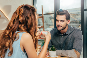 Fototapeta premium couple drinking coffee in cafe