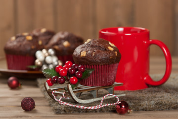 Chocolate Muffins With White Chocolate Chips. Mug Of Tea Or Coffee. Christmas Decorations.