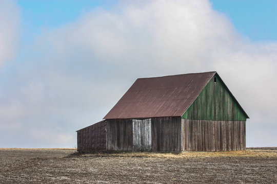 old barn in a field