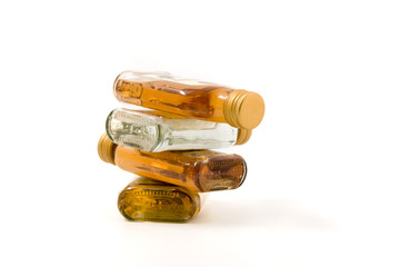 strong spirits of different colors in a glass bottle