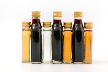 strong spirits of different colors in a glass bottle