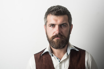 Man with long beard and mustache on serious face.