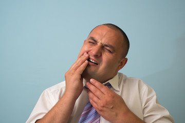 businessman having toothache