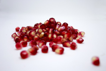 pomegranate seeds on a white background