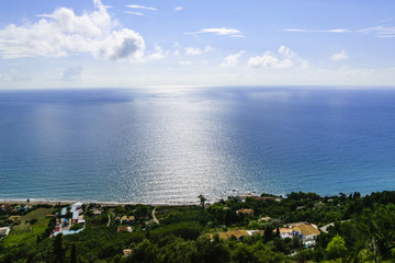 Fototapeta premium High Angle View Of Light Blue Sea Against Cloudy Sky