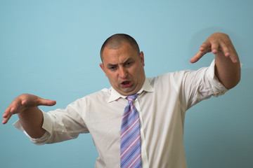 An angry businessman pointing at you